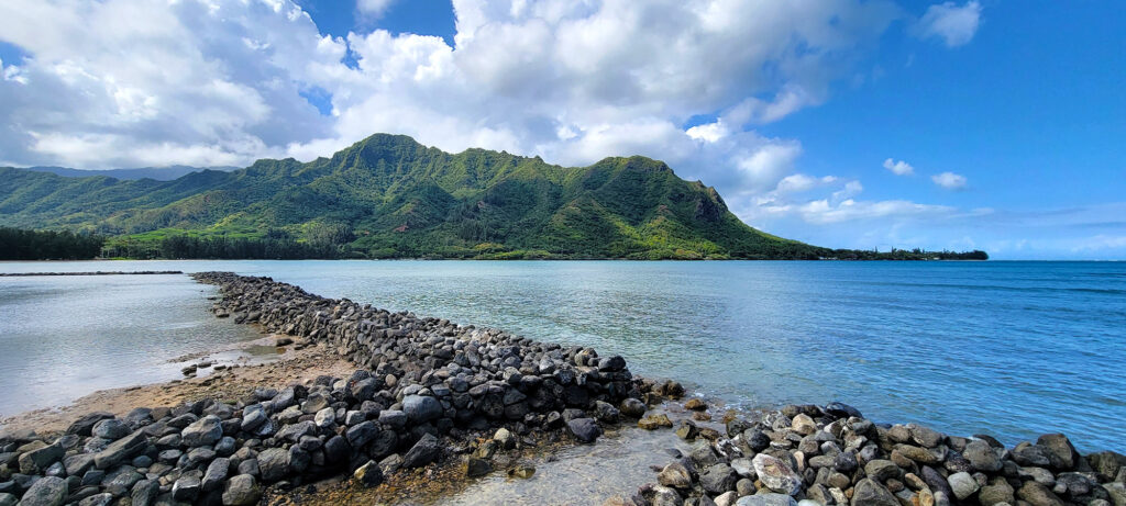 An Inlet in Oahu with Mountains in the Background