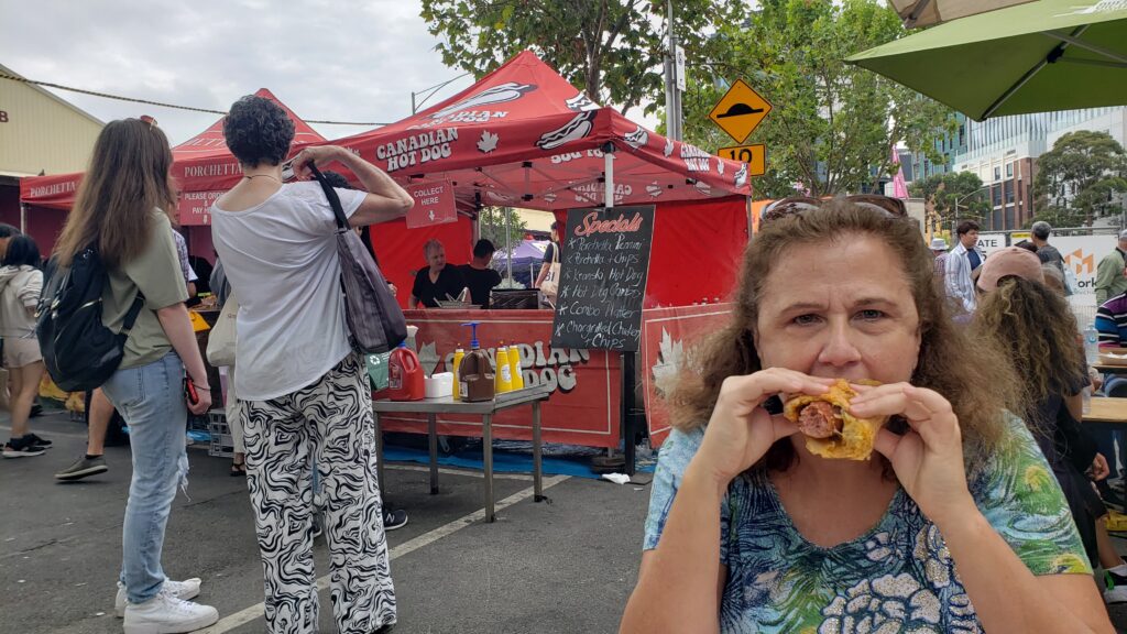 Eating a Canadian Hot Dog at the Queen Victoria Market in Melbourne