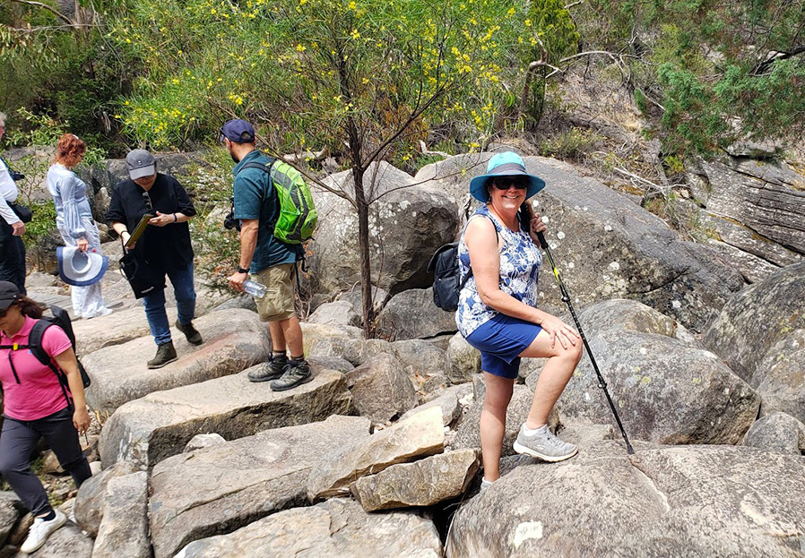 Woman with Hiking Stick on the Trail to Splitters Falls