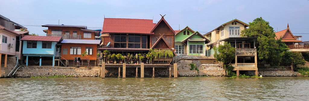 A row of houses on a canal in Ayutthaya, Thailand