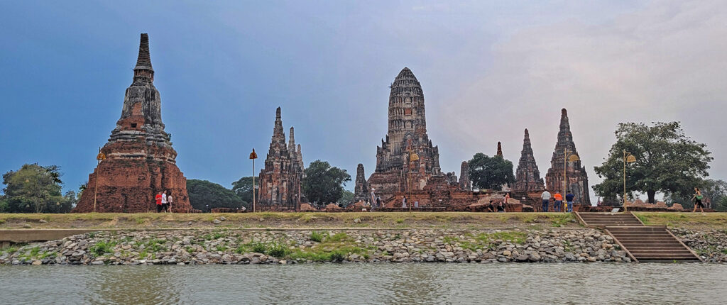 Ancient temples in Ayutthaya as seen along a canal.