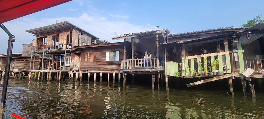 Dilapidated homes along a canal in Bangkok.