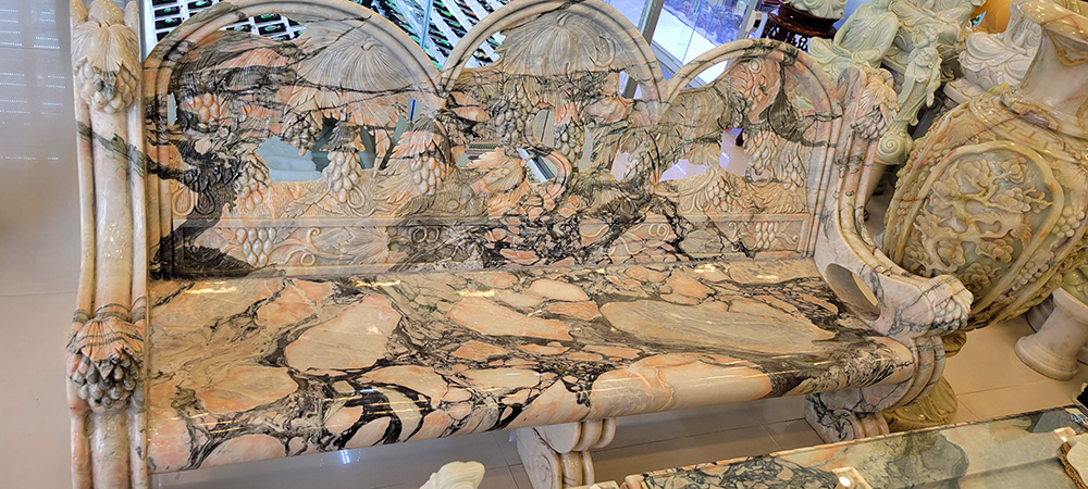 A marble bench at a store in the marble mountains