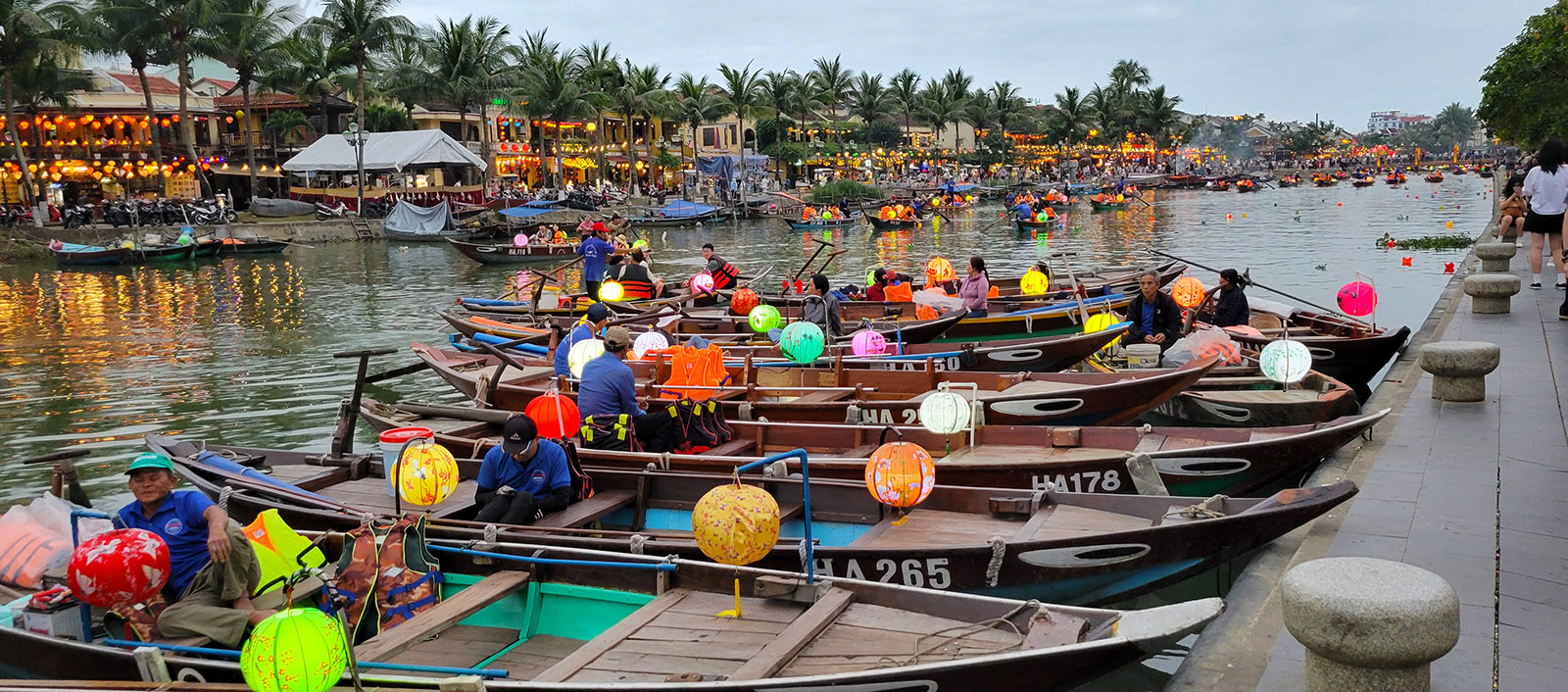 Boats lined up on the river in Hoi An as dusk approaches.