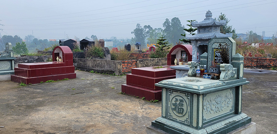 Tombs scattered in a Vietnamese graveyard.