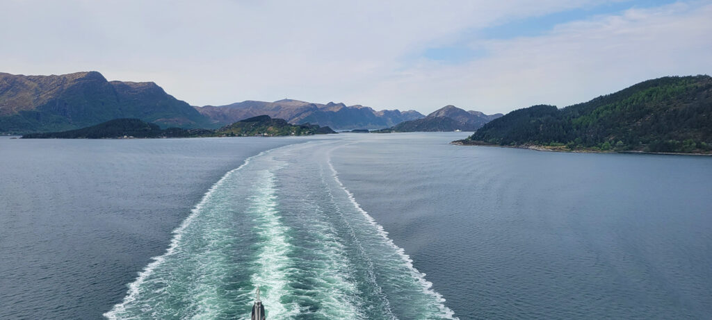 The wake of the Celebrity Apex as it sails out of Nordfjord, Norway.