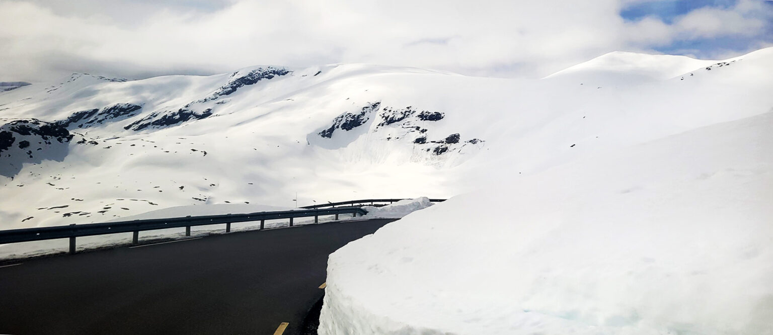 Snow banks on the road to Dalsnibba viewpoint in Norway.