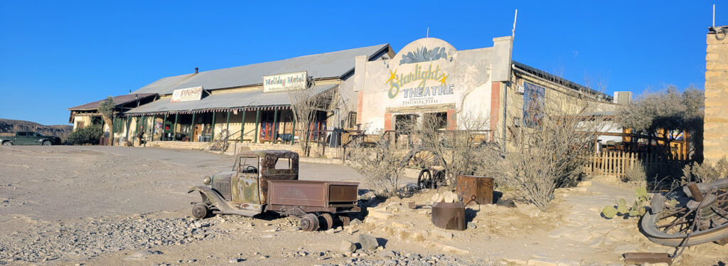 a desolate western scene with a building containing the Terlingua store, hotel and Starlight theatre restaurant.